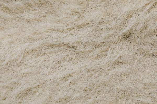 wool vs synthetic rugs